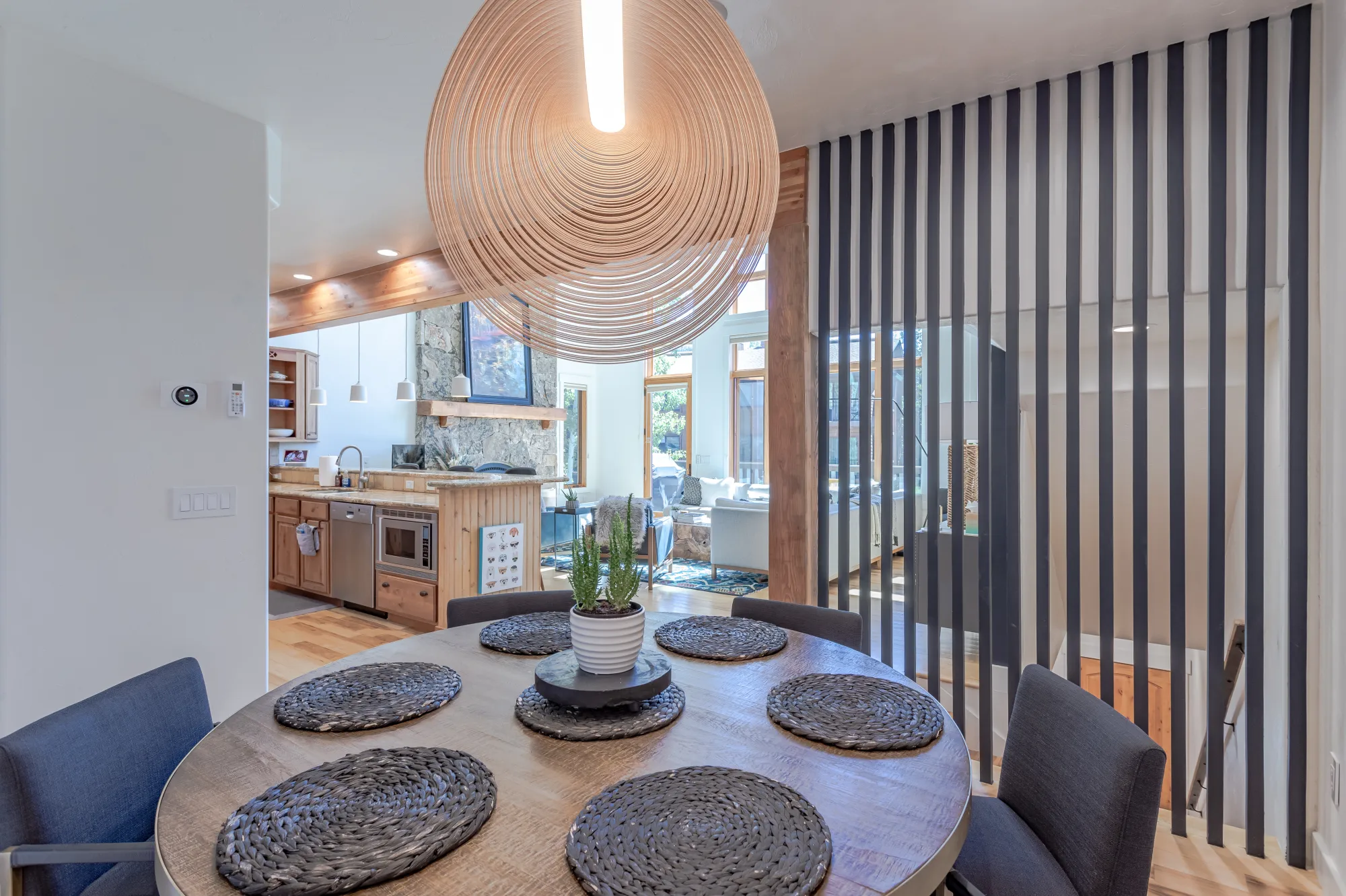 Dining for six under a sculptural pendant