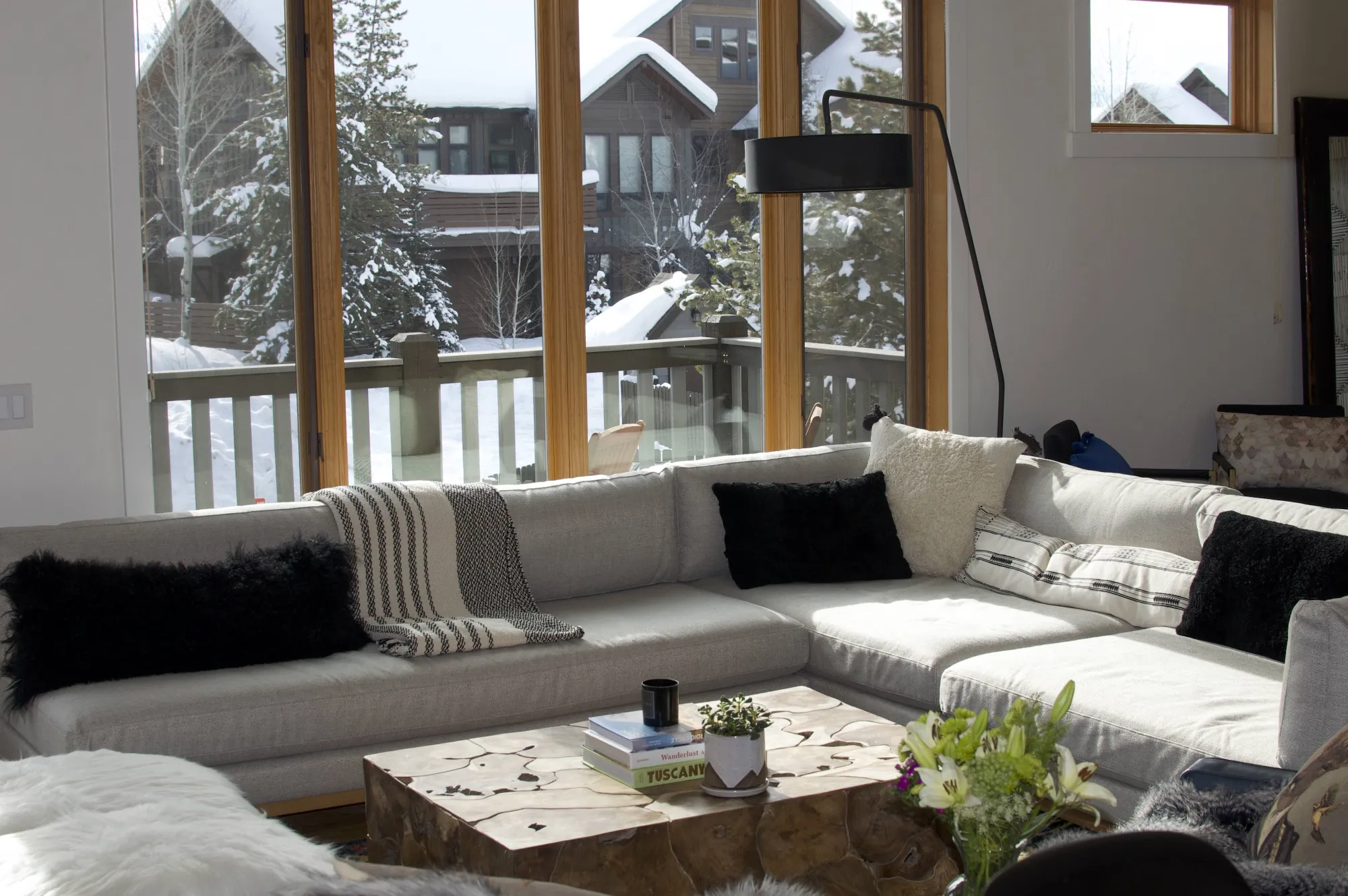 Sectional under two-story windows